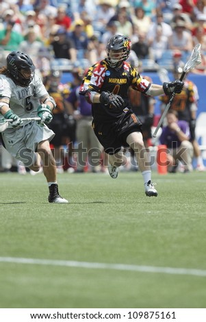 FOXBOROUGH - 28 MAY: Quinn Harley (4), University of Maryland, College Park, runs against a Loyola at the NCAA Men\'s Division 1 Lacrosse Championship game, Foxborough, Massachusetts, 28 May 2012.