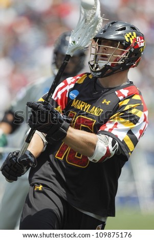 FOXBOROUGH - 28 MAY: Landon Carr (16) from the University of Maryland, College Park, passes the ball at the NCAA Men\'s Division 1 Lacrosse Championship game in Foxborough, Massachusetts, 28 May 2012.