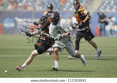 FOXBOROUGH - 28 MAY: John Haus (26) and Chris Layne (3) go for the ball after the face-off at the NCAA Men\'s Division 1 Lacrosse Championship game in Foxborough, Massachusetts, 28 May 2012