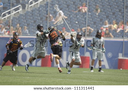 FOXBOROUGH - 28 MAY: Michael Shakespeare (10), Maryland, College Park, takes a shot against Pat Laconi (34), Loyola University, at the NCAA Men's Division 1 Lacrosse Championship game, 28 May 2012 in Foxborough, Massachusetts