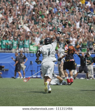 FOXBOROUGH - 28 MAY: Davis Butts (7), Loyola University Maryland, celebrates after a goal against Maryland, College Park at the NCAA Men\'s Division 1 Lacrosse Championship game, 28 May 2012 in Foxborough, Massachusetts