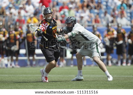 FOXBOROUGH - 28 MAY: Landon Carr (16), Maryland, College Park, tries to keep the ball against J.P. Dalton (45), Loyola University, at the NCAA Men\'s Division 1 Lacrosse Championship game, 28 May 2012 in Foxborough, Massachusetts