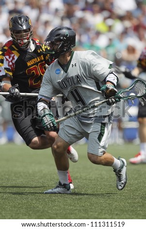FOXBOROUGH - 28 MAY: Mike Sawyer (4), Loyola University, goes against T.J. Harris (28), Maryland, College Park at the NCAA Men\'s Division 1 Lacrosse Championship game, 28 May 2012 in Foxborough, Massachusetts