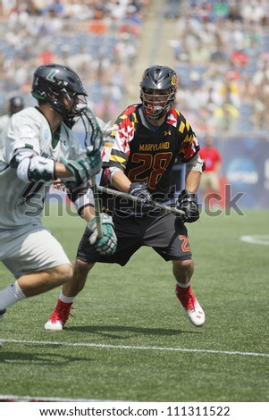 FOXBOROUGH - 28 MAY: Michael Ehrhardt (28), University of Maryland, College Park, defends the goal against a Loyola attacker at the NCAA Men\'s Division 1 Lacrosse Championship game, 28 May 2012 in Foxborough, Massachusetts