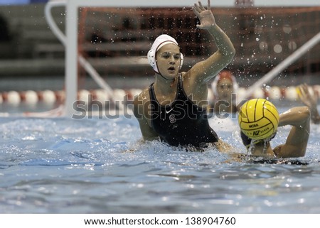 BOSTON - 12 MAY: Kiley Neushul (3), Stanford University, defends the goal at the NCAA Women's Division 1 championship Water Polo game in Boston, Massachusetts, 12 May 2013