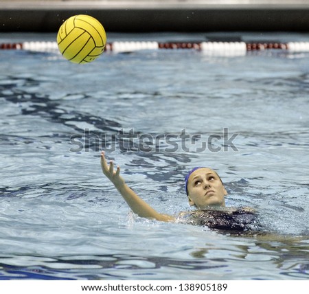 BOSTON - 12 MAY: A water polo player warms up at a NCAA Women\'s Division 1 Water Polo game in Boston, Massachusetts, 12 May 2013