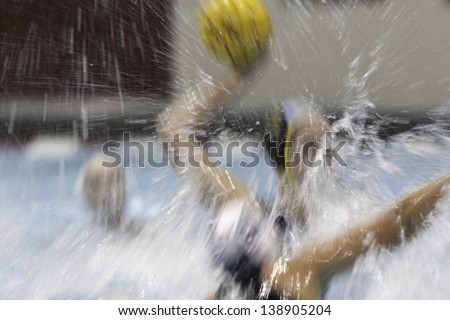 BOSTON - 12 MAY: A water polo player gets ready to take a shot on goal at a NCAA Women\'s Division 1 Water Polo game in Boston, Massachusetts, 12 May 2013