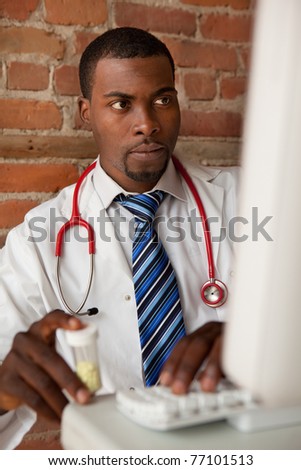 Young doctor prescribing medication