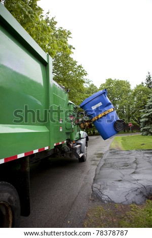 Recycling truck picking up bin - Vertical