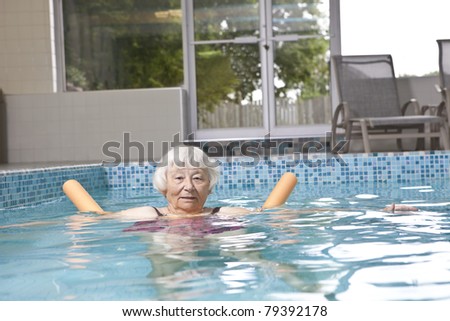 Senior woman aqua fitness