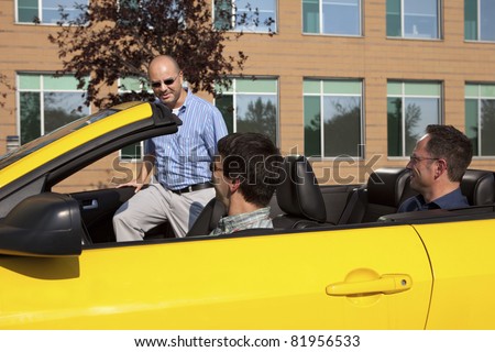Work colleagues car pooling from the office