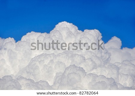 Puffy clouds and blue sky