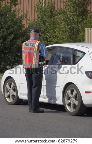 Police officer issuing speeding ticket