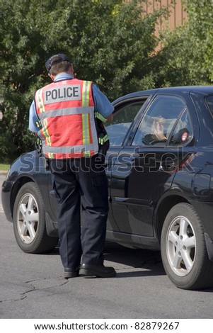 Police officer issuing speeding ticket