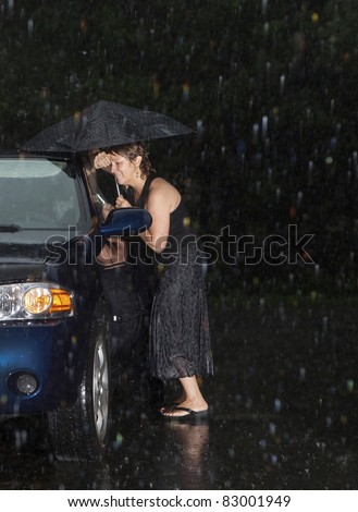 Woman locked out of her car in the rain