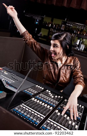 Soundboard technician doing a sound check