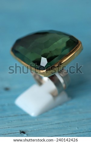 Jewelry ring on old wooden table