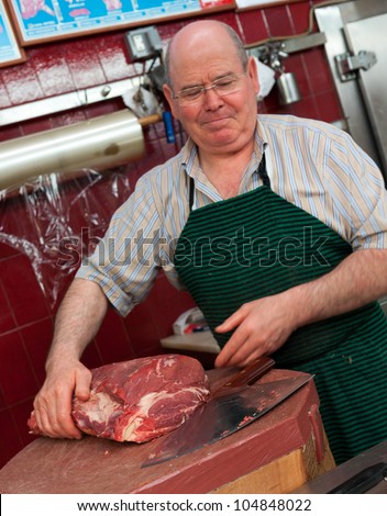 Butcher at the cutting block