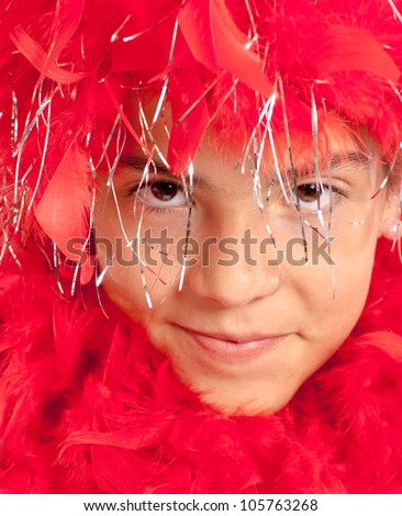 Teenager costumed with a red feather boa for a party