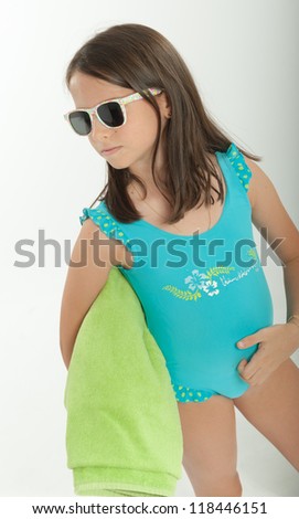 Young girl with sunglasses and swimming costume
