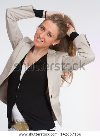 Happy woman in her early stages of pregnancy