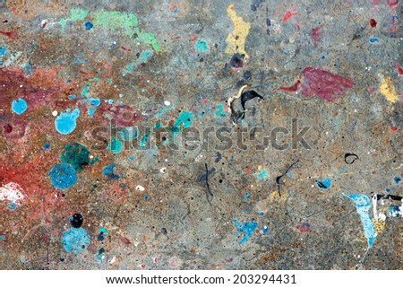 Concrete floor with multicolored paint stains