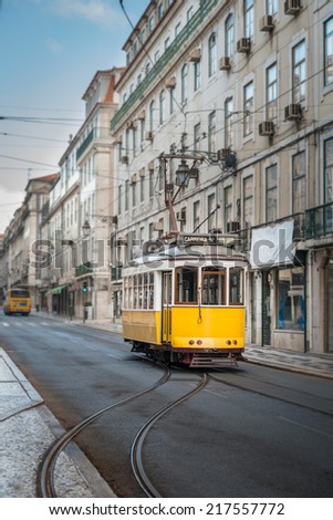 Vintage yellow tramway in the streets of Lisbon