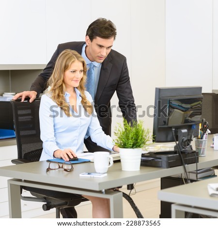 Man and woman working together at the office