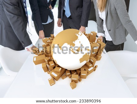 Meeting with people around a table with a world surrounded by cardboard boxes