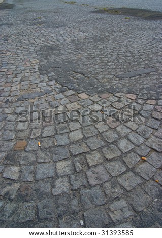 Shot of a dirty cobblestone road