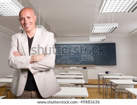 stock photo Portrait of a smiling mature teacher in an empty classroom