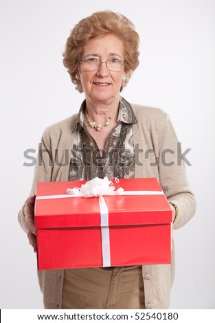 stock photo Elegant mature woman holding a red gift box