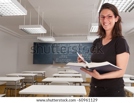 Cheerful female teacher in a maths classroom