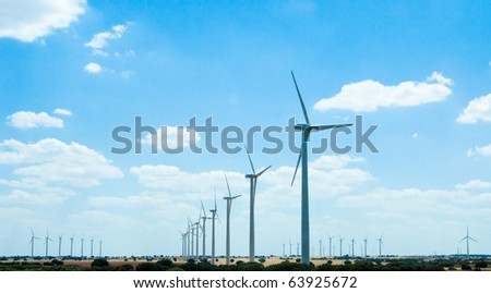 Landscape with power generating windmills