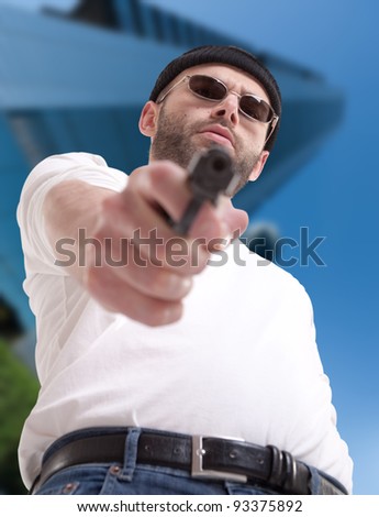 Man with gun in an urban environment