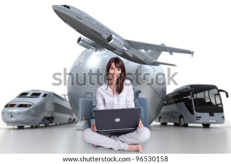 Young woman sitting on the floor with a laptop with an international tourism background