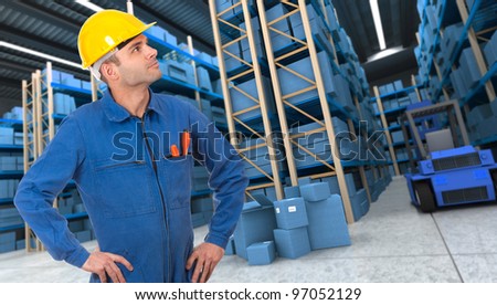 Man with helmet and blue overalls in a distribution warehouse