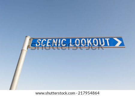 A sign to a scenic lookout or a point of interest, with blue sky as background and copy space.