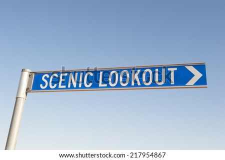 A street sign to a scenic lookout or a point of interest, with blue sky as background and copy space.