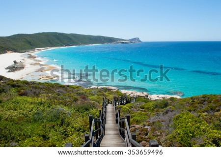 Scenic panoramic view of cliff coast and Cable Beach at Torndirrup National Park, Albany, Western Australia, wild Southern Ocean, blue sky, copy space.