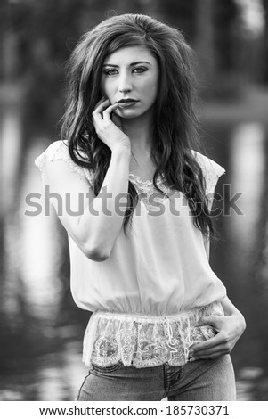 Black and white portrait of a fashion model in a white shirt