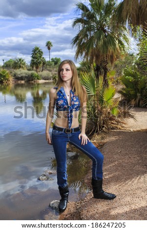 Beautiful young female model posing in paradise