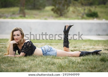 Female model with long legs and tall black boots