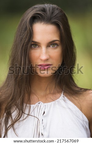 Profile portrait of a brunette beauty model with long straight hair