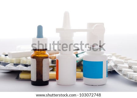 Medical supplies, nose drops, nasal spray, oral spray, pills, tablets and capsules. Isolated on white background.