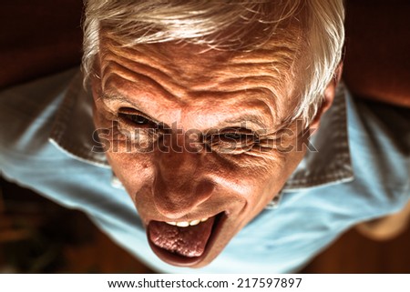 Closeup of senior man making funny face