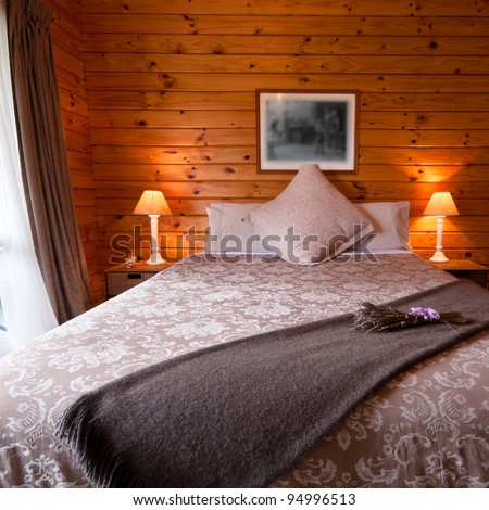 Detail of mountain wooden lodge bedroom. Fox Glacier Lodge, Fox Glacier, West Coast, South Island, New Zealand.