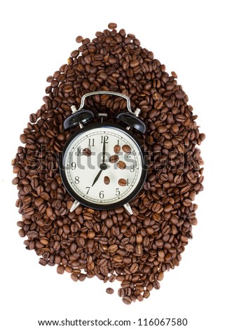 early morning - clock and raw coffee beans isolated on white background