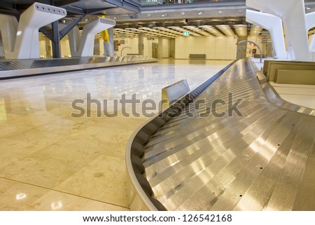empty modern luggage belt in the airport, focus on belt