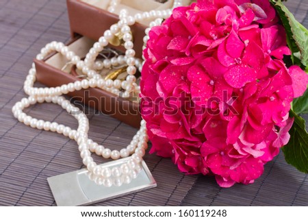 pink hortensia flowers and open jewel box